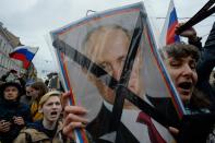 <p>Opposition supporters attend an unauthorized anti-Putin rally called by opposition leader Alexei Navalny on May 5, 2018 in Saint Petersburg, two days ahead of Vladimir Putin’s inauguration for a fourth Kremlin term. (Photo: Olga Maltseva/AFP/Getty Images) </p>