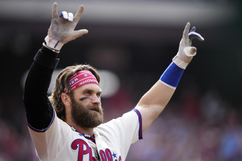 Philadelphia Phillies' Bryce Harper reacts after hitting a two-run home run during the eighth inning of a baseball game against the Los Angeles Angels, Wednesday, Aug. 30, 2023, in Philadelphia. (AP Photo/Matt Slocum)