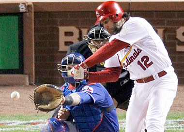 The Cardinals' Lance Berkman hits a two-run single off C.J. Wilson