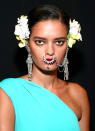 <p>Naeem Khan models sported oversized septum jewelry adorning a classic dark red lip shade. (Photo: Getty Images) </p>