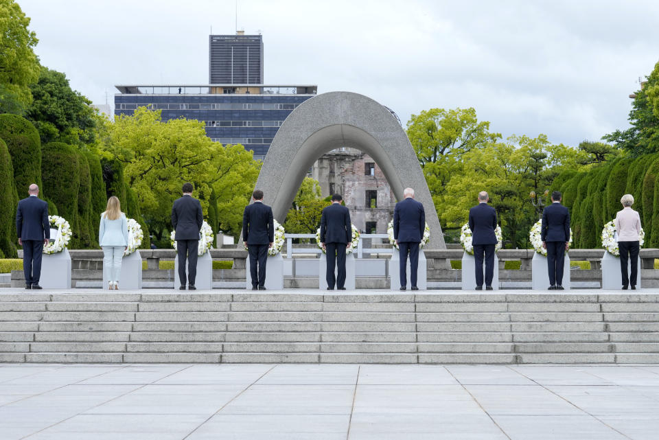 President Joe Biden, fourth right, and other G7 leaders react after laying a wreath at the Hiroshima Peace Memorial Park in Hiroshima, Japan, Friday, May 19, 2023, during the G7 Summit. Pictured from left: President Charles Michel of the European Council, Prime Minister Giorgia Meloni of Italy, Prime Minister Justin Trudeau of Canada, President Emmanuel Macron of France, Prime Minister Fumio Kishida of Japan, U.S. President Joe Biden, Chancellor Olaf Scholz of Germany, Prime Minister Rishi Sunak of the United Kingdom and President Ursula von der Leyen of the European Commission.(AP Photo/Susan Walsh,Pool)