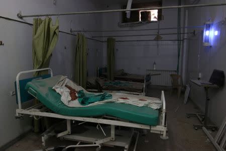 Blood stains a bed inside an empty room at a damaged field hospital after airstrikes in a rebel held area in Aleppo, Syria October 1, 2016. REUTERS/Abdalrhman Ismail