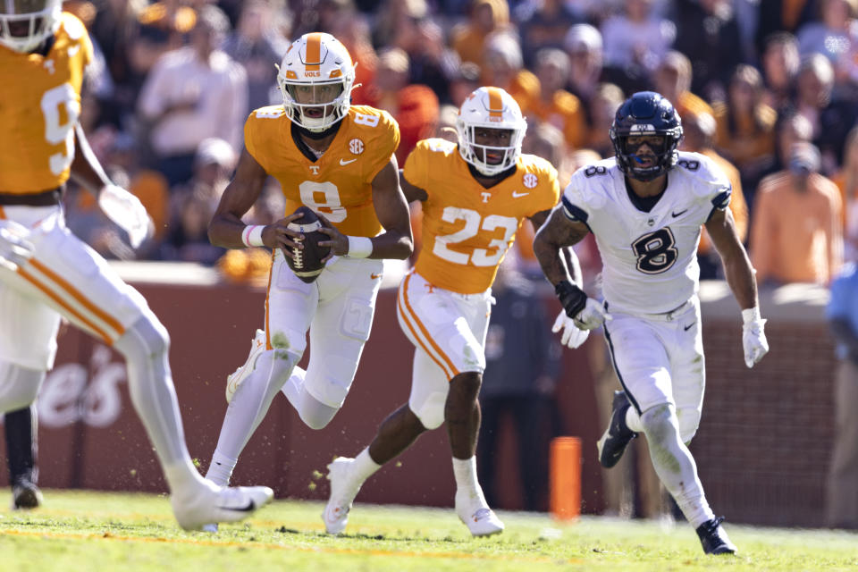 Tennessee quarterback Nico Iamaleava (8) runs for yardage during the second half of an NCAA college football game against UConn, Saturday, Nov. 4, 2023, in Knoxville, Tenn. (AP Photo/Wade Payne)