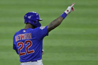 Chicago Cubs' Jason Heyward points toward the dugout after hitting a one-run double in the ninth inning in a baseball game against the Cleveland Indians, Wednesday, Aug. 12, 2020, in Cleveland. (AP Photo/Tony Dejak)