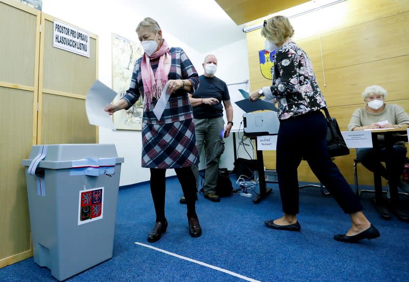 People cast their ballots during the parliamentary elections in Lovosice