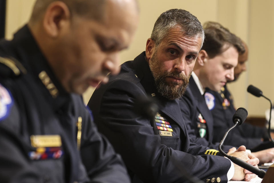 Metropolitan Police Department officer Michael Fanone, center, listens while Aquilino Gonell, sergeant with the U.S. Capitol Police, speaks during a committee hearing on Tuesday. (Oliver Contreras/The New York Times/Bloomberg via Getty Images)