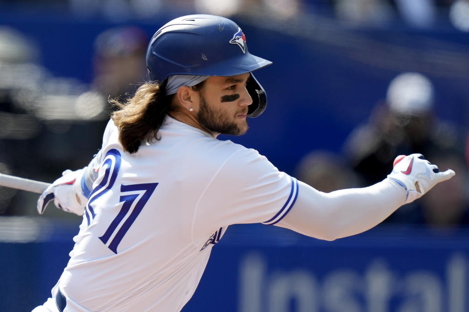 FILE - Toronto Blue Jays' Bo Bichette watches his single during the first inning of the team's baseball game against the Tampa Bay Rays in Toronto on Sept. 15, 2022. The Blue Jays have agreed to terms with Bichette on a three-year contract, avoiding arbitration, the team announced Thursday, Feb. 9. (Frank Gunn/The Canadian Press via AP, File)