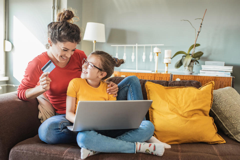 mom and daughter shopping online together