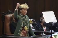 Indonesian President Joko Widodo gestures as he delivers his annual State of the Nation Address ahead of the country's Independence Day, at the parliament building in Jakarta, Indonesia, Tuesday, Aug. 16, 2022. (Bagus Indahono/Pool Photo via AP)