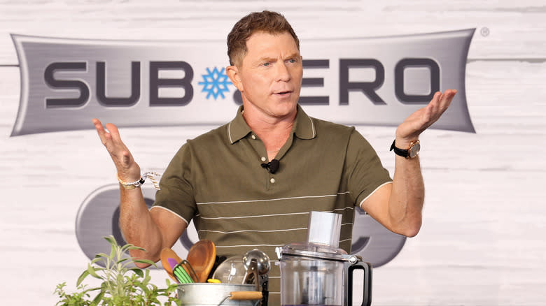 Bobby Flay holds out his hands