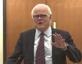 In this screen grab from video, defense attorney Earl Gray questions a potential juror as Hennepin County Judge Regina Chu presides over jury selection Friday, Dec. 3, 2021, in the trial of former Brooklyn Center police Officer Kim Potter at the Hennepin County Courthouse in Minneapolis, Minn. Potter is charged with first- and second-degree manslaughter in the April 11 shooting of Wright, a 20-year-old Black motorist, following a traffic stop in the Minneapolis suburb of Brooklyn Center. (Court TV, via AP, Pool)