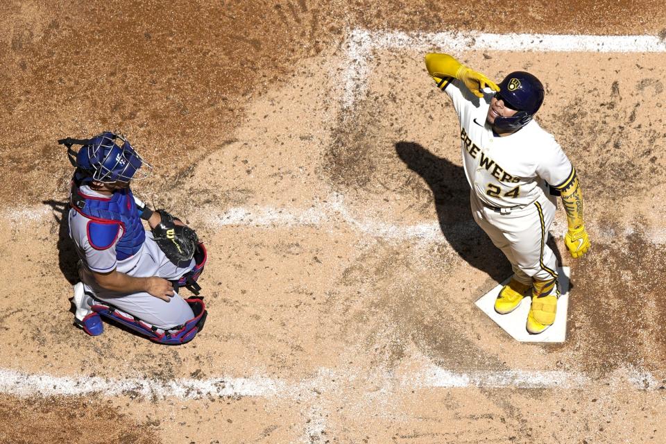 Milwaukee Brewers' William Contreras reacts on home plate after hitting a home run during the fourth inning of a baseball game against the Los Angeles Dodgers Wednesday, May 10, 2023, in Milwaukee. (AP Photo/Morry Gash)