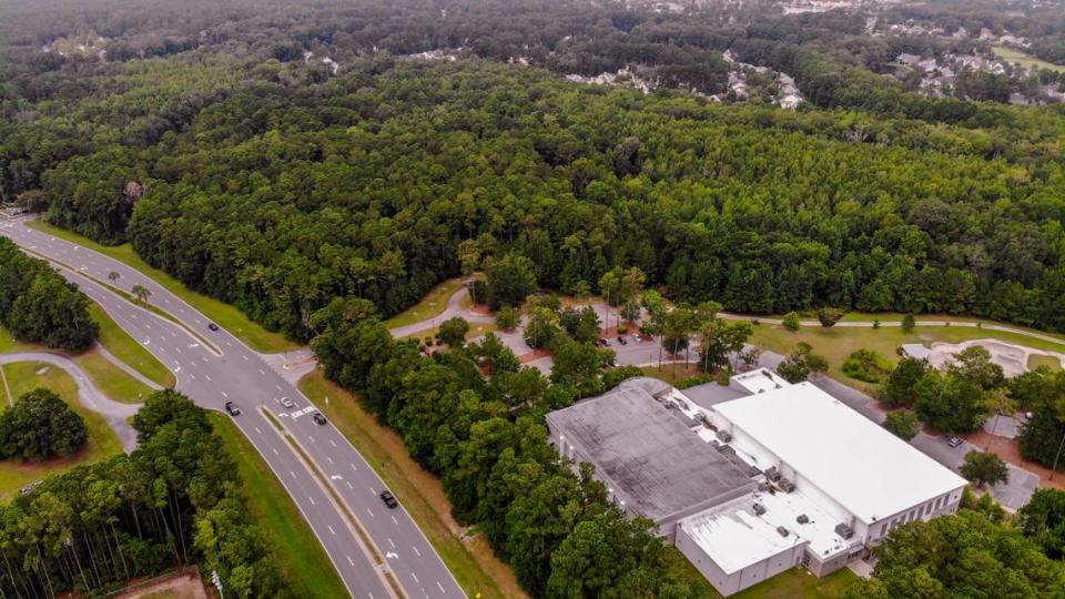 Three baseball fields, batting cages and a press box were planned for the forested area of the Buckwalter Recreation Center -- its main building pictured -- as seen on Thursday, Aug. 11, 2022, located along Buckwalter Parkway in Bluffton. Wetlands are now scaling back development plans by about 22 acres for the Beaufort County land. Two lighted soccer fields with parking are being proposed.