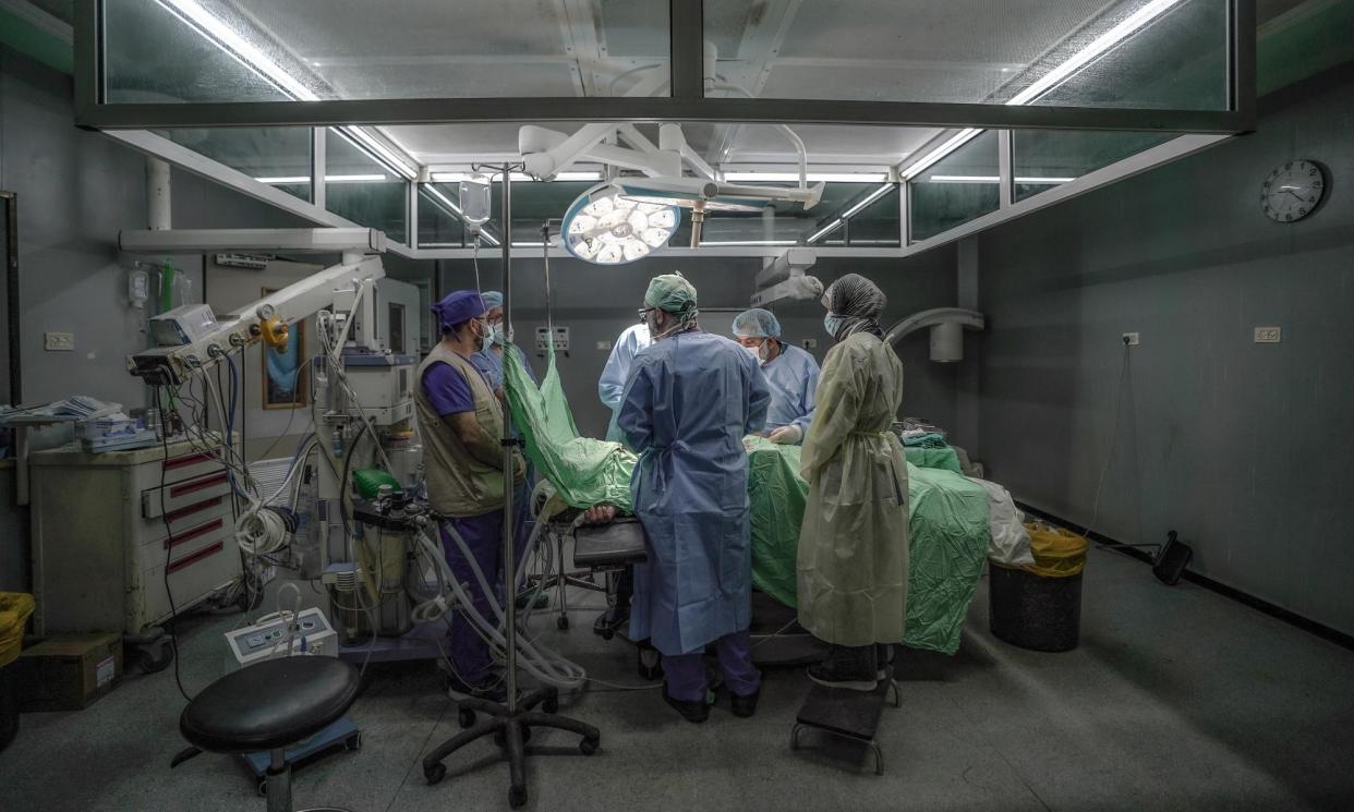 <span>EMT staff in theatre at the European hospital in Gaza on 5 March.</span><span>Photograph: Belal Khaled/IRC</span>