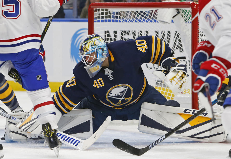 Buffalo Sabres goalie Carter Hutton makes a save in traffic during the second period of the team's NHL hockey game against the Montreal Canadiens, Friday, Nov. 23, 2018, in Buffalo N.Y. (AP Photo/Jeffrey T. Barnes)