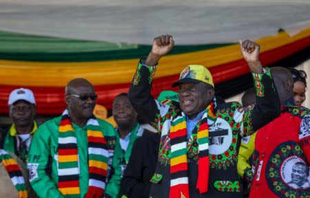 Zimbabwean President Emmerson Mnangagwa greets supporters before an explosion at an election rally in Bulawayo, Zimbabwe June 23, 2018. Tafadzwa Ufumeli/via REUTERS