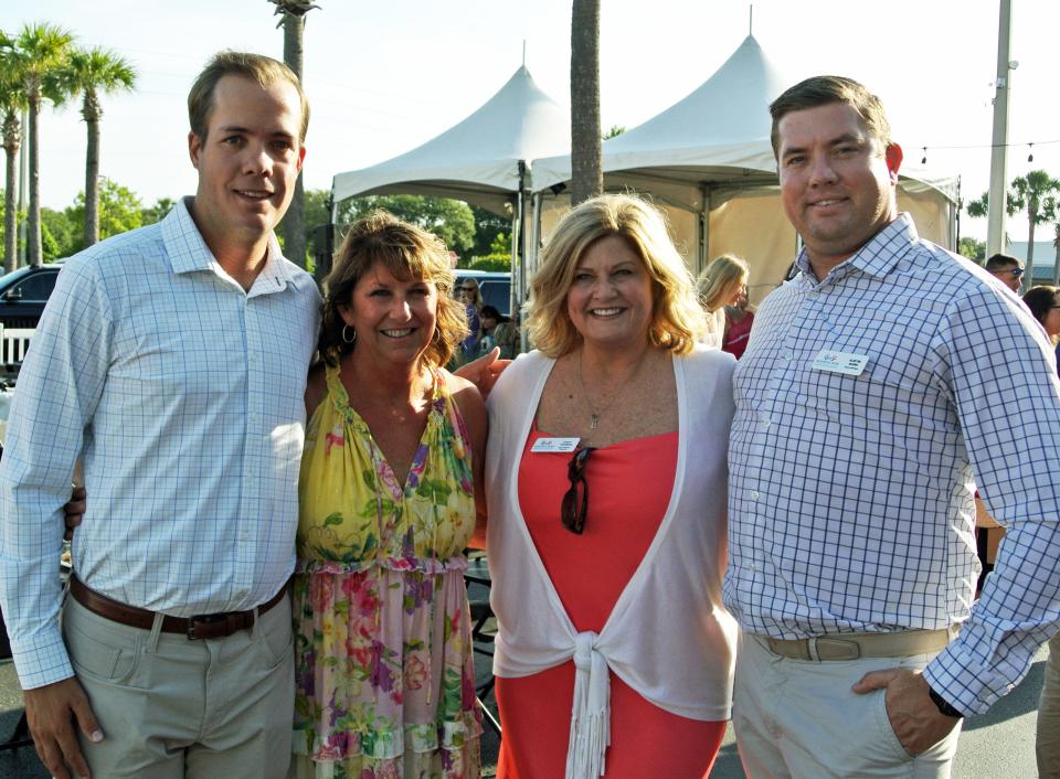 Garrison Burr (from left), Monique Burr Foundation executive director Lynn Layton, foundation vice president of programs Stacy Vaughan and Austin Burr enjoyed the Night in the Vineyard party to benefit the foundation honoring the Burrs mother Monique.