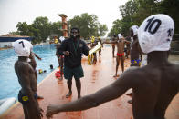 Asante Prince, the founder of Ghana's Awatu Winton Water Polo Club, shares tips with participants at the University of Ghana ahead of the Black Star water polo competition in Accra, Ghana, Saturday, Jan. 14, 2023. Former water polo pro Asante Prince is training young players in the sport in his father's homeland of Ghana, where swimming pools are rare and the ocean is seen as dangerous. (AP Photo/Misper Apawu)