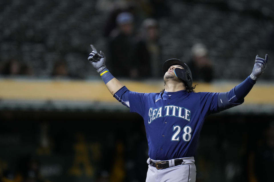 Seattle Mariners' Eugenio Suárez celebrates after hitting a three-run home run against the Oakland Athletics during the 10th inning of a baseball game in Oakland, Calif., Wednesday, May 3, 2023. (AP Photo/Godofredo A. Vásquez)