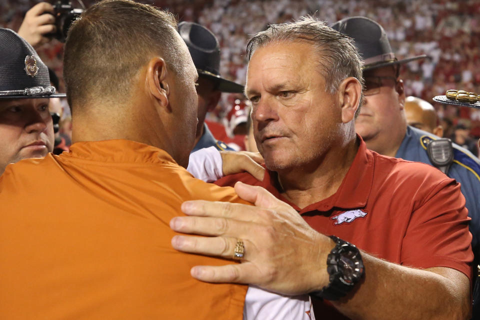 Sep 11, 2021; Fayetteville, Arkansas, USA; Arkansas Razorbacks head coach Sam Pittman talks to Texas Longhorns head coach Steve Sarkisian after the game at Donald W. Reynolds Razorback Stadium. Arkansas won 40-21. Mandatory Credit: Nelson Chenault-USA TODAY Sports