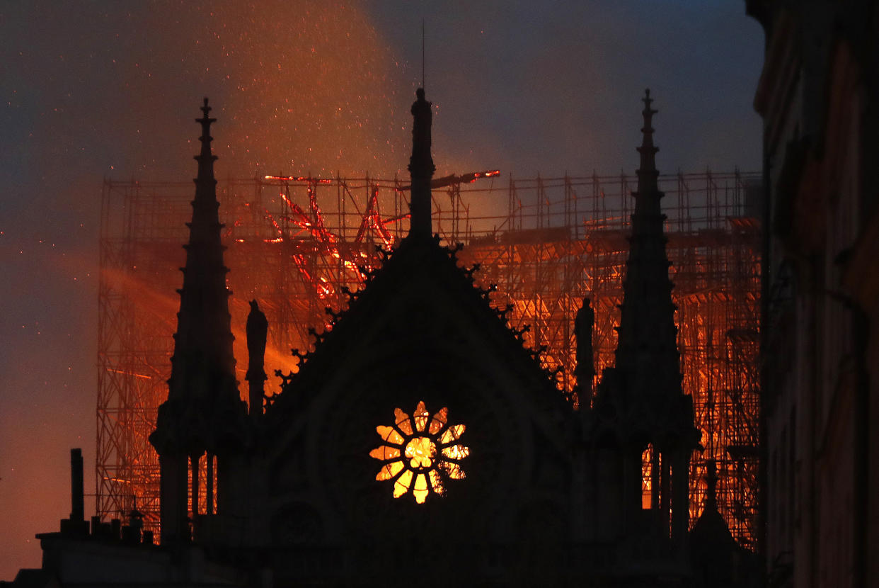 Flames and smoke rise from Notre Dame cathedral as it burns in Paris, Monday, April 15, 2019. (Photo: Thibault Camus/AP)