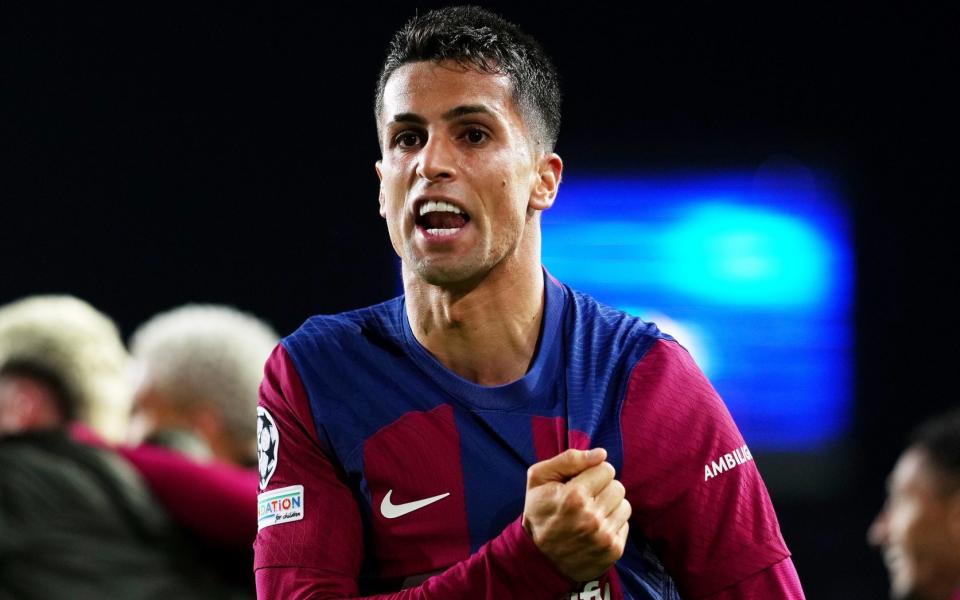 Joao Cancelo celebrates after Robert Lewandowski scores Barcelona's third goal against Napoli in the Champions League