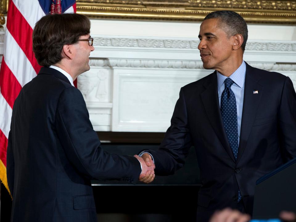 Jason Furman and Barack Obama shake hands