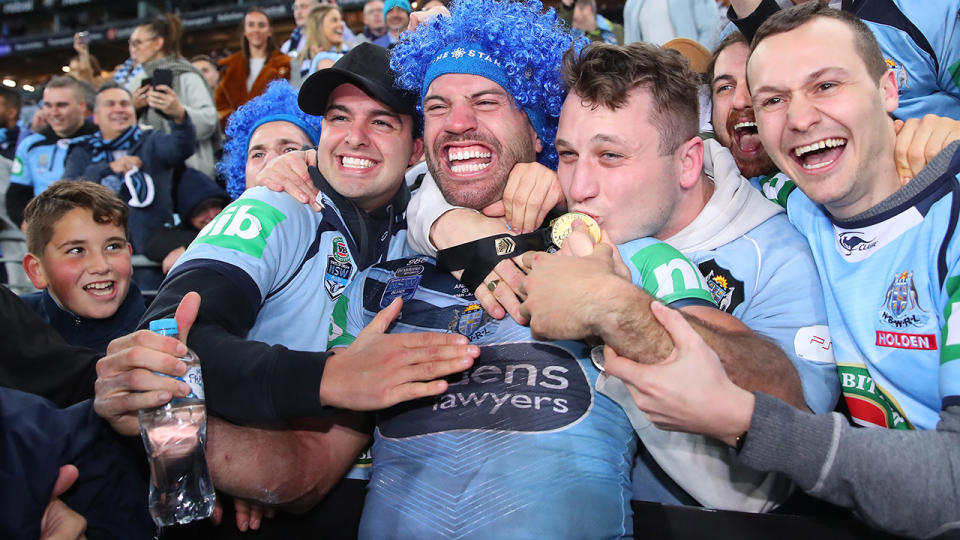 James Tedesco of the Blues poses with fans after winning game three of the 2019 State of Origin series. (Photo by Cameron Spencer/Getty Images)