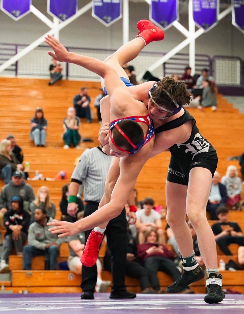 Bloomington South’s Wyatt Cooksey (right) wrestles against Owen Valley’s Branson Weaver in the 144 pound final during the IHSAA wrestling regional at Bloomington South on Saturday, Feb. 3, 2024.