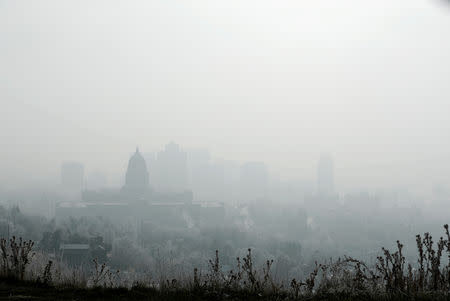 FILE PHOTO: The Utah State Capitol and buildings are shrouded in smog in downtown Salt Lake City, Utah, U.S. December 12, 2017. REUTERS/George Frey/File photo