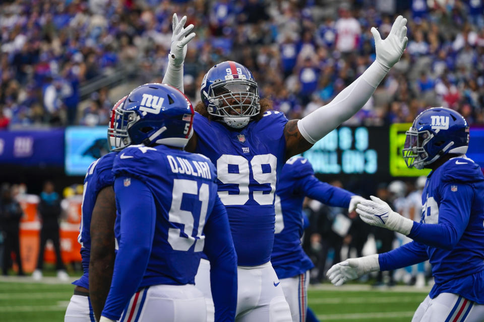 New York Giants' Leonard Williams (99) celebrates with teammates after the Giants scored on a safety during the first half of an NFL football game against the Carolina Panthers, Sunday, Oct. 24, 2021, in East Rutherford, N.J. (AP Photo/Seth Wenig)
