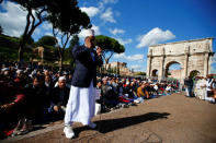 Muslims hold Friday prayers in front of the Colosseum in Rome, Italy October 21, 2016, to protest against the closure of unlicensed mosques. REUTERS/Tony Gentile