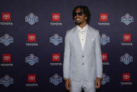 LSU quarterback Jayden Daniels poses on the red carpet ahead of the first round of the NFL football draft, Thursday, April 25, 2024, in Detroit. (AP Photo/Carlos Osorio)