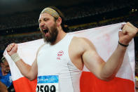 BEIJING - AUGUST 15: Tomasz Majewski of Poland celebrates winning the Men's Shot Put Final and the gold medal at the National Stadium on Day 7 of the Beijing 2008 Olympic Games on August 15, 2008 in Beijing, China. Tomasz Majewski of Poland won with a throw of 21.51m. (Photo by Michael Steele/Getty Images)