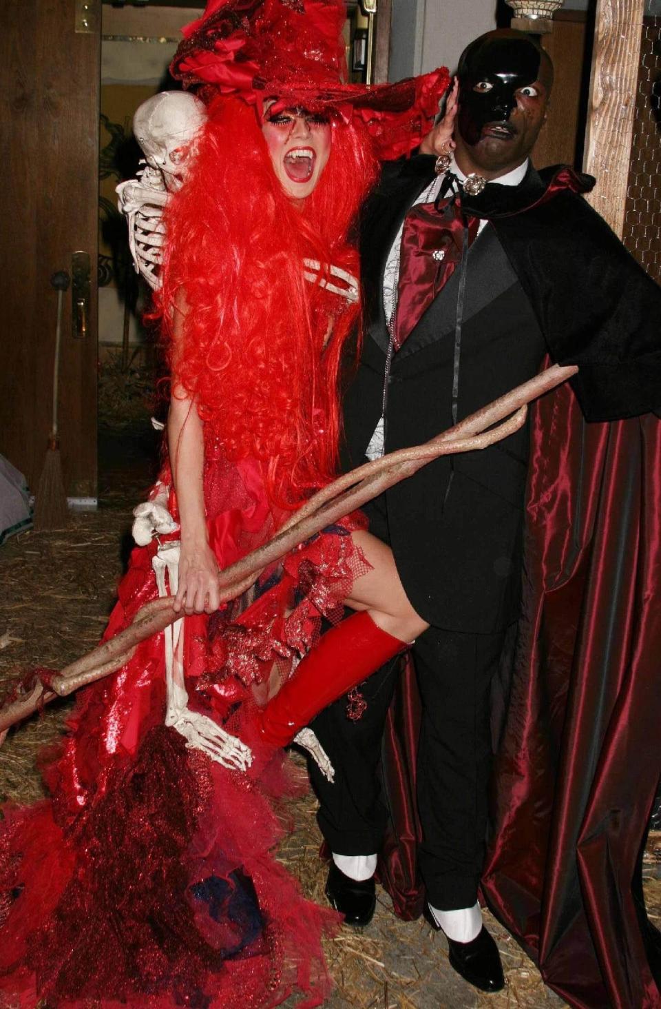 Heidi Klum, pictured with Seal, dresses as a witch for her 2004 Halloween party. - Credit: PNP/WENN/Newscom/MEGA