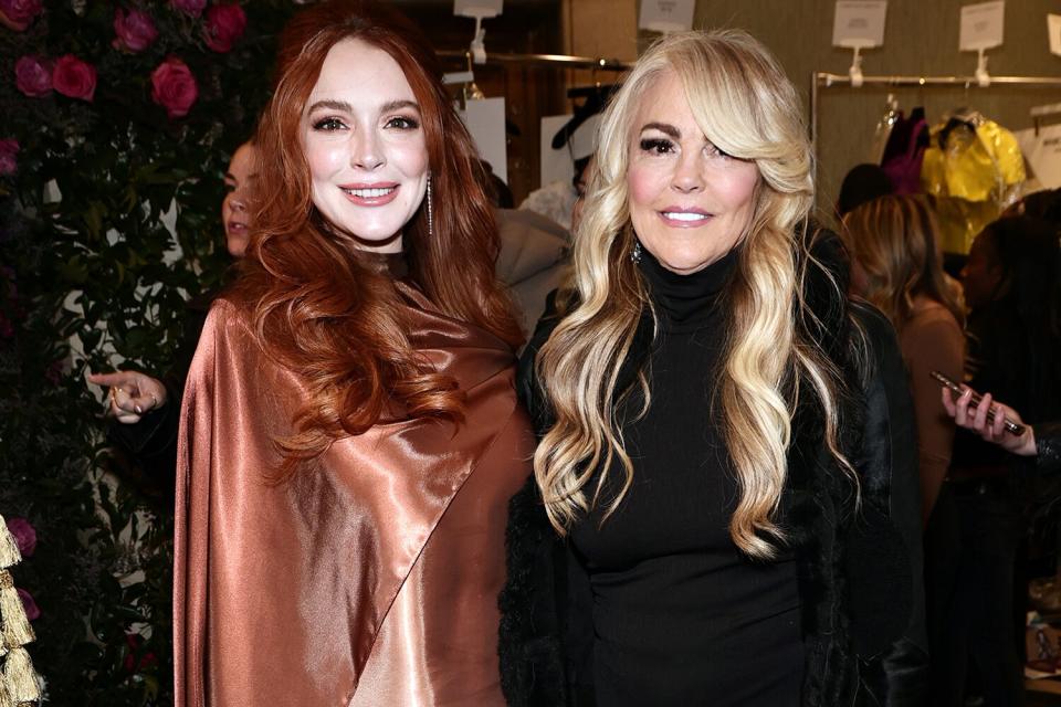 Lindsay Lohan and Dina Lohan pose backstage at the Christian Siriano Fall/Winter 2023 NYFW Show