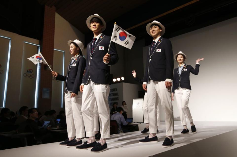 South Korean Olympic athletes and models present the South Korean Olympic team uniforms for the opening and closing ceremonies of the 2016 Rio de Janeiro Olympic Games at Korean National Training Center in Seoul, South Korea, Wednesday, April 27, 2016. South Korea's Olympic committee on Wednesday unveiled long-sleeved shirts and pants it says will help protect the country's Olympic athletes from the mosquito-borne Zika virus at this year's games in Rio de Janeiro. (AP Photo/Lee Jin-man)