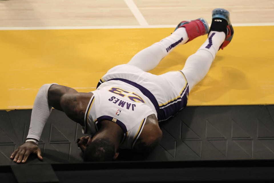 LeBron James #23 of the Los Angeles Lakers reacts to an apparent injury during the second period of a game against the Atlanta Hawks at Staples Center on March 20, 2021 in Los Angeles, California. NOTE TO USER: User expressly acknowledges and agrees that, by downloading and or using this photograph, User is consenting to the terms and conditions of the Getty Images License Agreement. (Photo by Michael Owens/Getty Images)