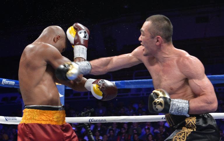 Bernard Hopkins (L) of the US defends against Beibut Shumenov of the US during their WBA & IBA Light-heavyweight title fight at the DC Armory in Washington on April 19, 2014