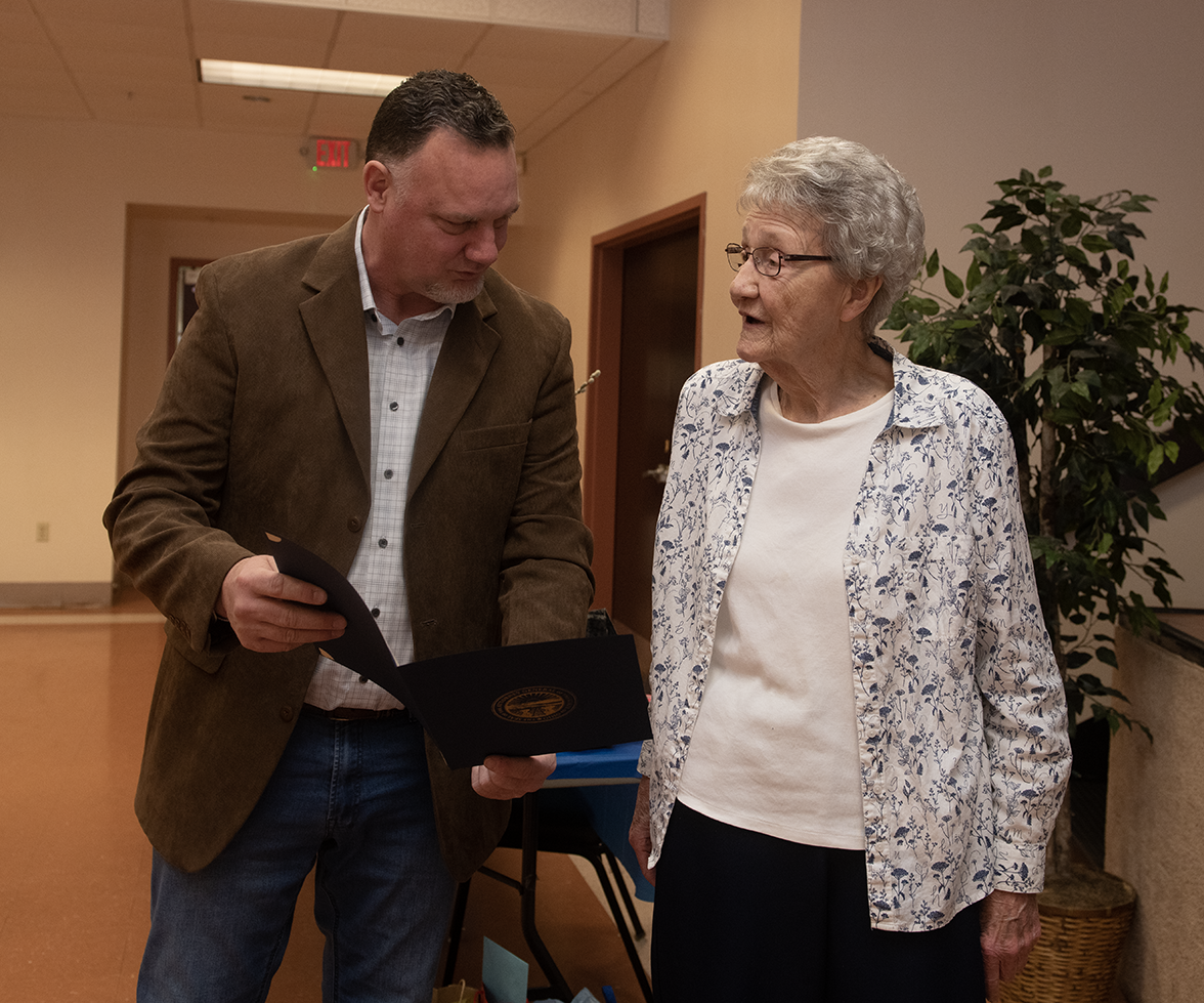 New Portage County Auditor Matt Kelly, delivers a proclamation from Ohio Attorney General Dave Yost to Janet Esposito, who recently retired after seven terms as the Portage County Auditor.