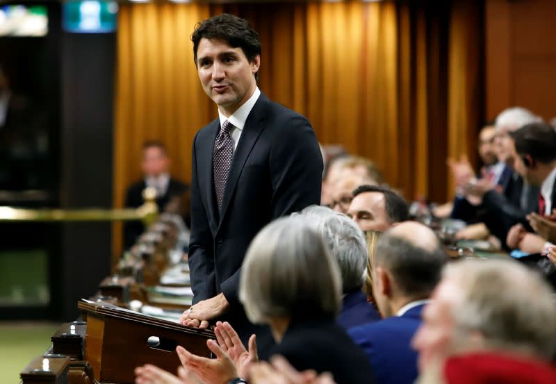 Canada's Prime Minister Justin Trudeau welcomes Members of Parliament to the House of Commons as parliament prepares to resume for the first time since the election in Ottawa