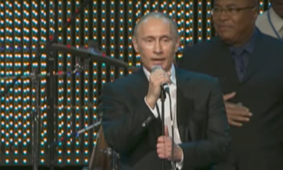 <em>Centre stage – Vladimir Putin performed Blueberry Hill at a charity fundraiser (Picture: YouTube/RT)</em>