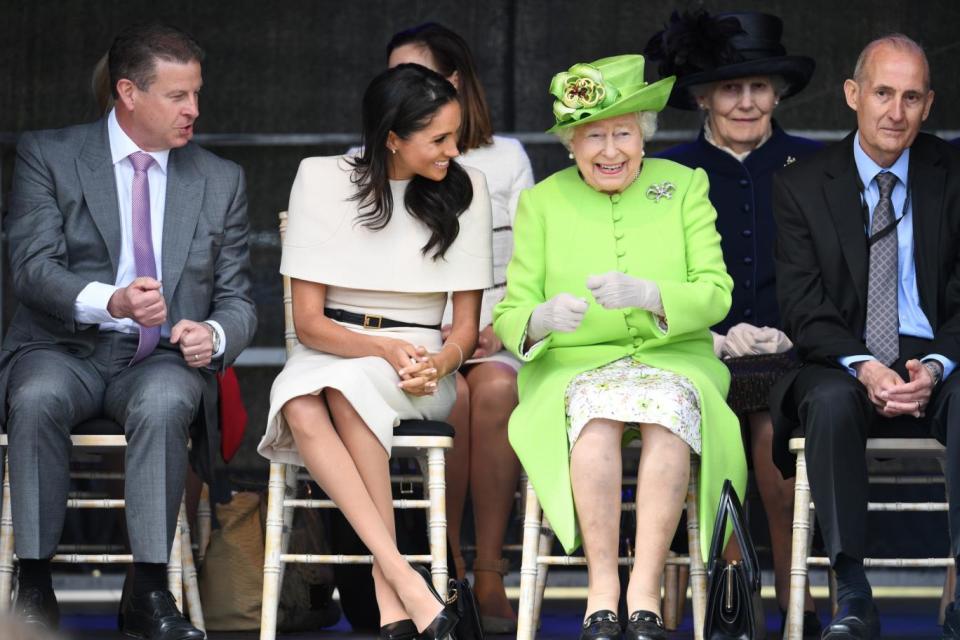 Meghan and the Queen during a visit to Widnes in Cheshire (Getty Images)