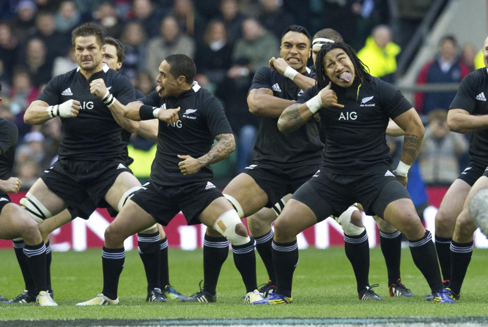 FILE - New Zealand perform a Haka before their international rugby union match against England at Twickenham stadium, London, on Dec. 1, 2012. New Zealand rugby teams have been performing the haka before matches for 135 years. It was adopted from New Zealand's Indigenous Maori, who used the social custom for welcomes, big occasions, and funerals. (AP Photo/Tom Hevezi, File)