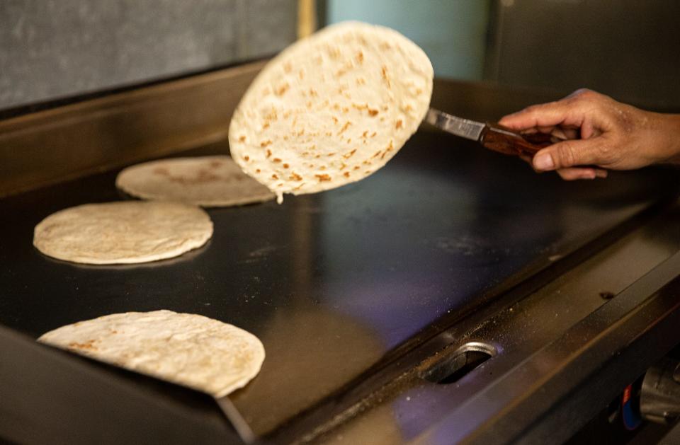 Francis Leyba cooks fresh tortillas at Hi-Ho Restaurant on March 22, 2022, in Corpus Christi, Texas.