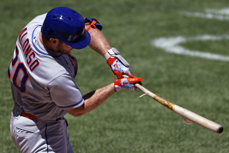 New York Mets' Pete Alonso breaks his bat as he grounds out against the New York Yankees during the second inning of the first baseball game of a doubleheader, Sunday, Aug. 30, 2020, in New York. (AP Photo/Adam Hunger)
