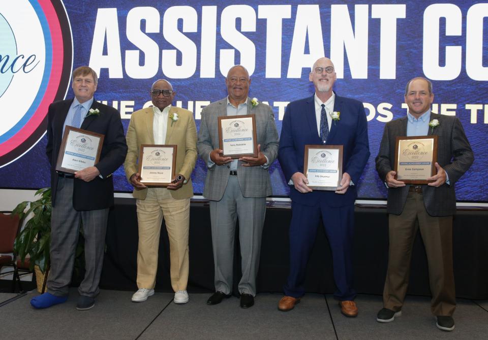 NFL assistant coaches pose for a group photo after receiving the Pro Football Hall of Fame Award of Excellence Thursday, June 30, 2022 at the Pro Football Hall of Fame. 