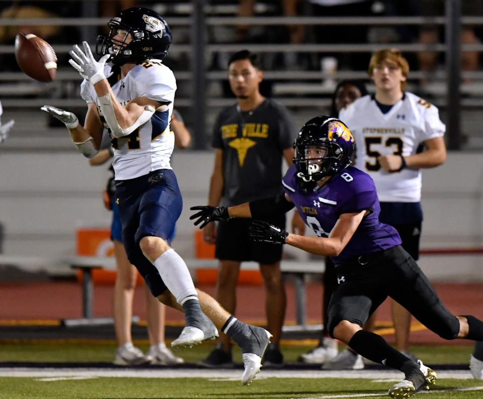 Stephenville defensive back Austin Jergins intercepts a pass meant for Wylie wide receiver Braden Regala during Friday's game at Bulldog Stadium.