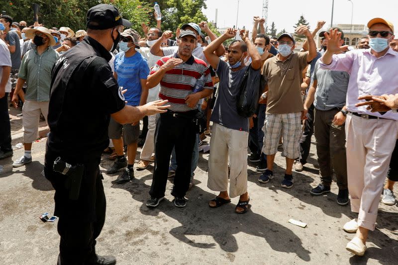 Tunisians gather after president ousts government, in Tunis