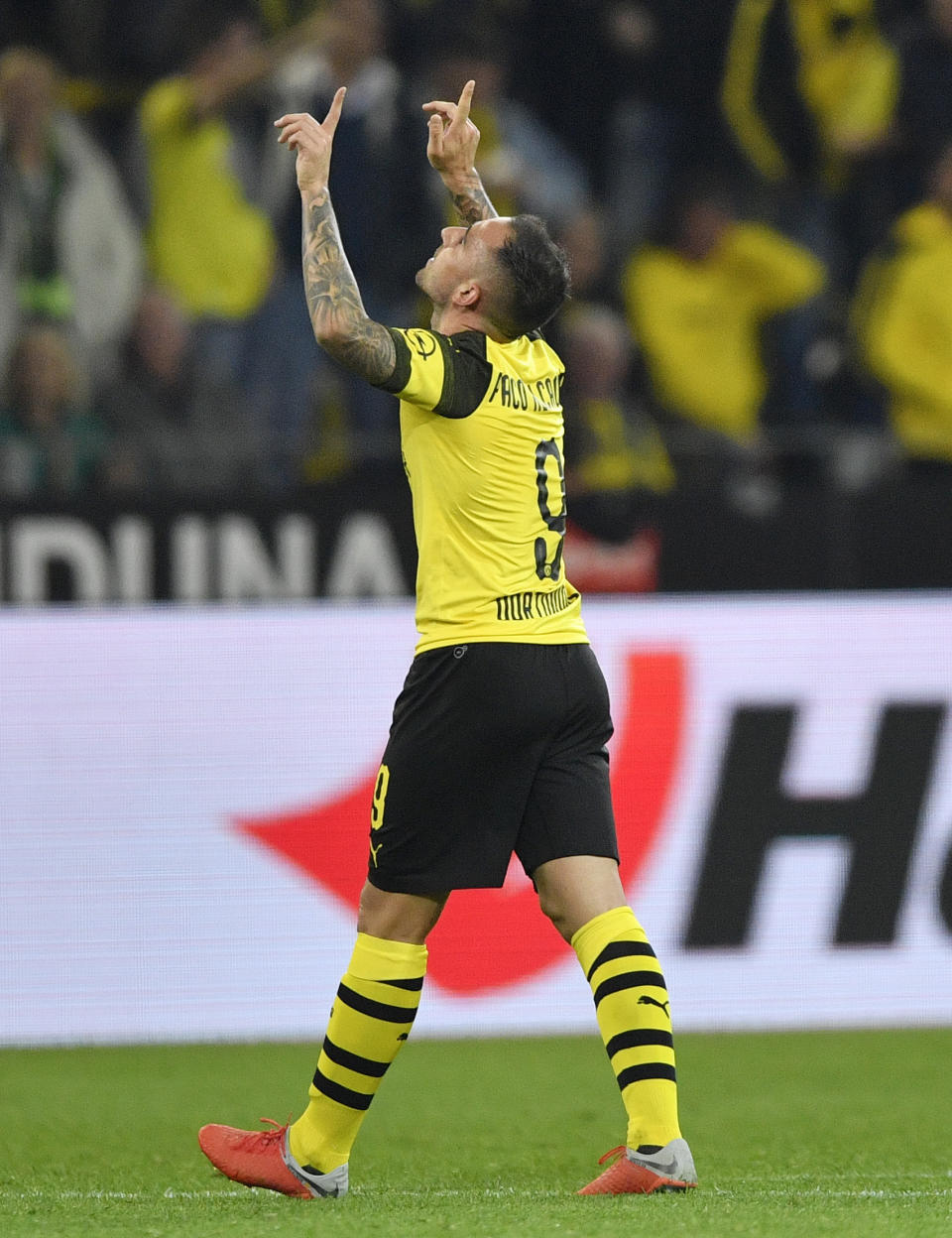 Dortmund's new forward Paco Alcacer celebrates after scoring his side's third goal at his debut during the German Bundesliga soccer match between Borussia Dortmund and Eintracht Frankfurt in Dortmund, Germany, Friday, Sept. 14, 2018. (AP Photo/Martin Meissner)